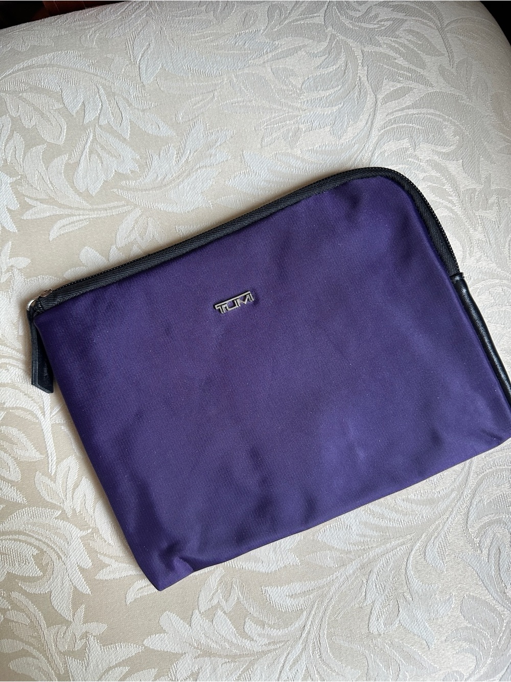 Tumi purple fabric toiletry amenity travel pouch designed for Delta Airlines